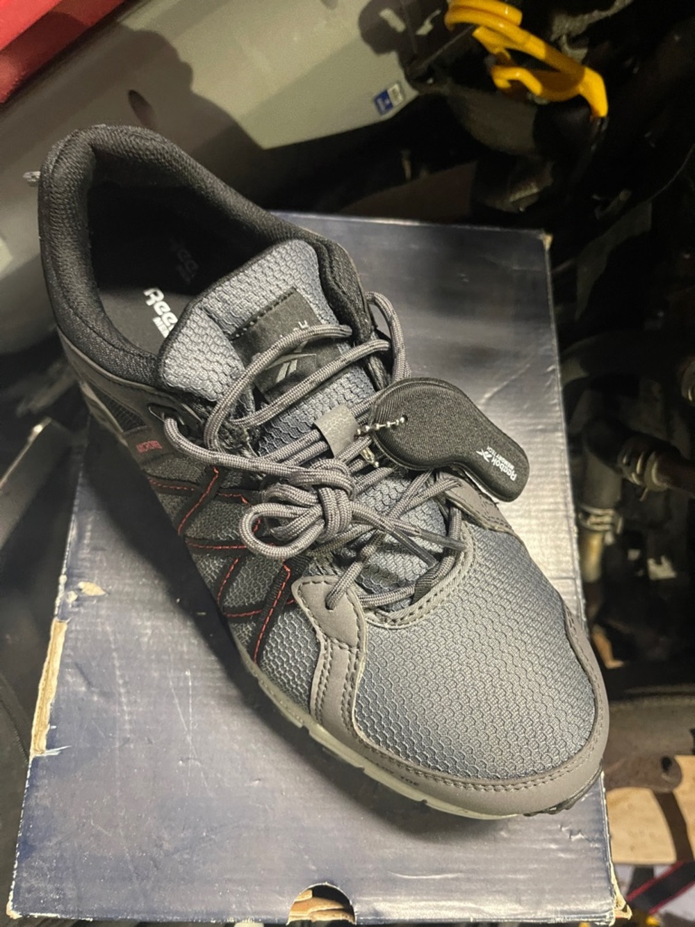 Reebok Men's Dark Gray work Shoe with Red Accents